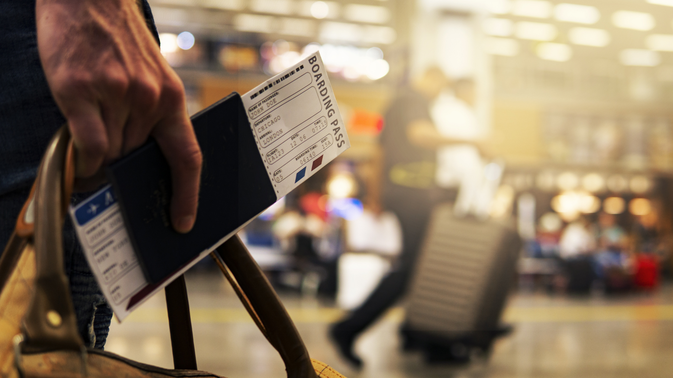 traveling Passport in hand in airport